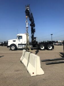 A crane carrying a weight to perform a stability test